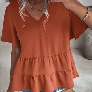 Butterfly sleeve peplum blouse.